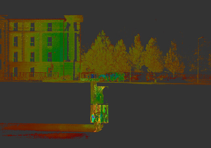 an image showing infrared light/rays of a building and trees beside it